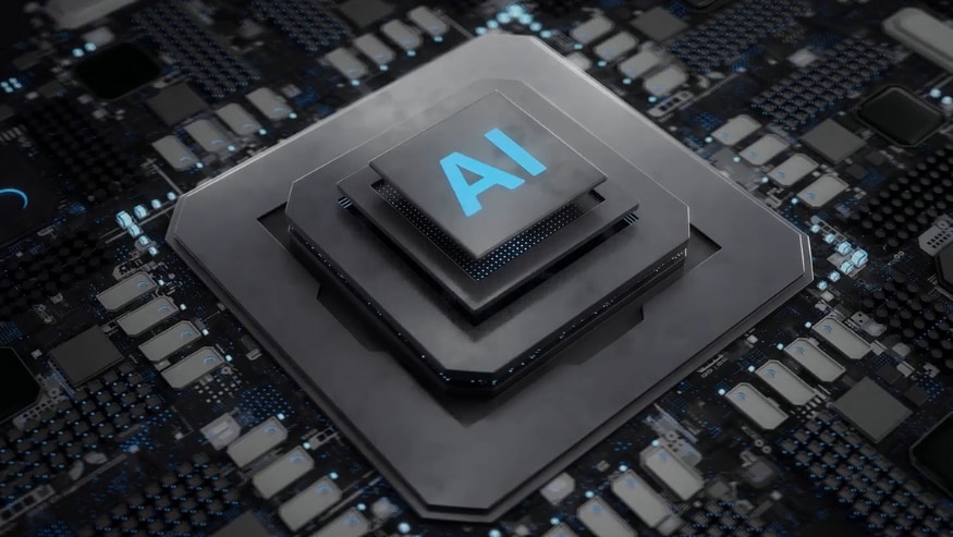 a close-up of a computer chip labeled "AI" in bold blue letters, positioned on a circuit board. 