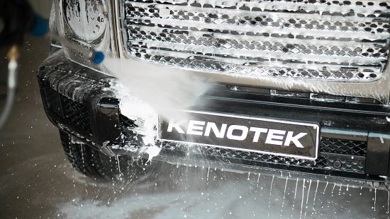 Front of Kenotek car being manually sprayed with Kenotek cleaning products.